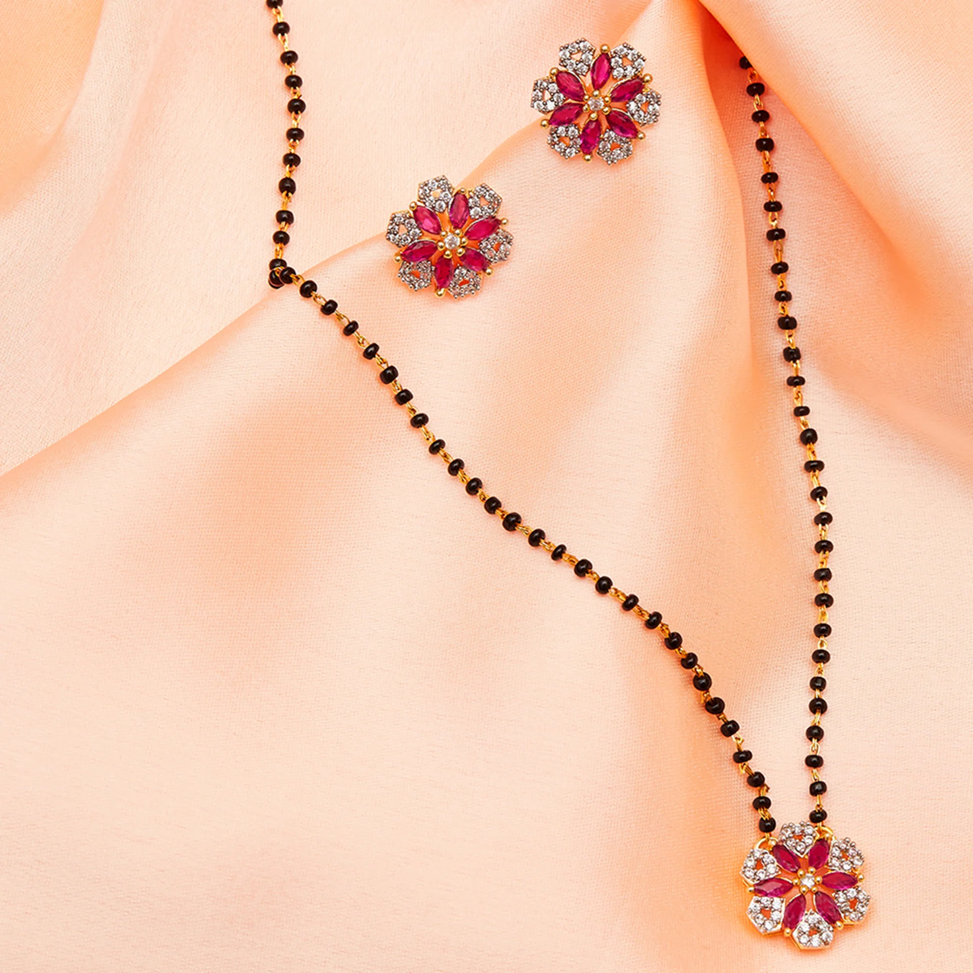 Shimmering Floret American Diamond CZ Gold Plated Brass Black Beaded Mangalsutra with Earrings