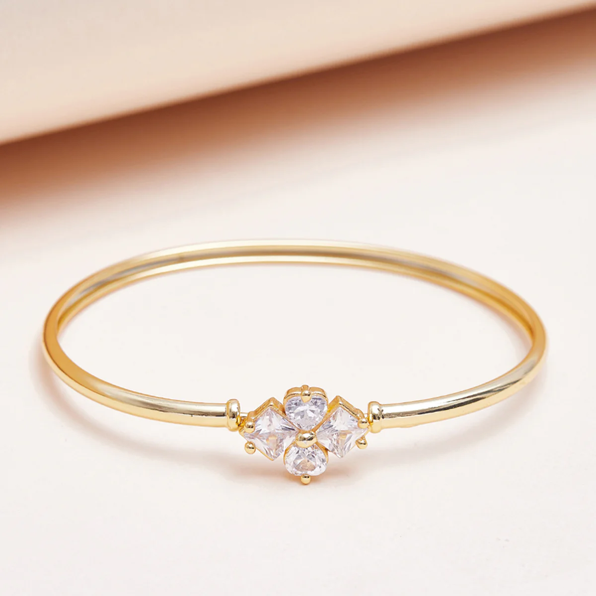 Floral Design Bracelet with Gold Finish and Zircons