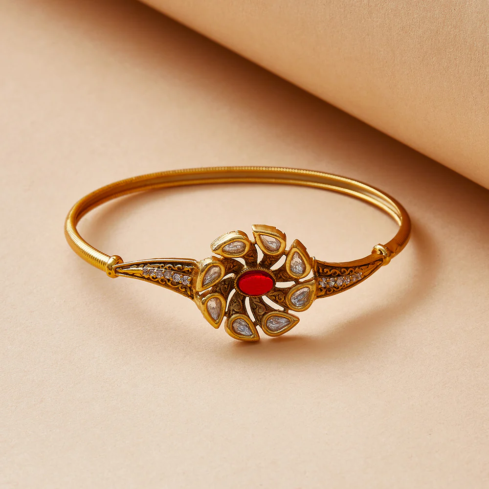 Floral Teardrop Cut Kundan Embellished Brass Gold Plated Bracelet
