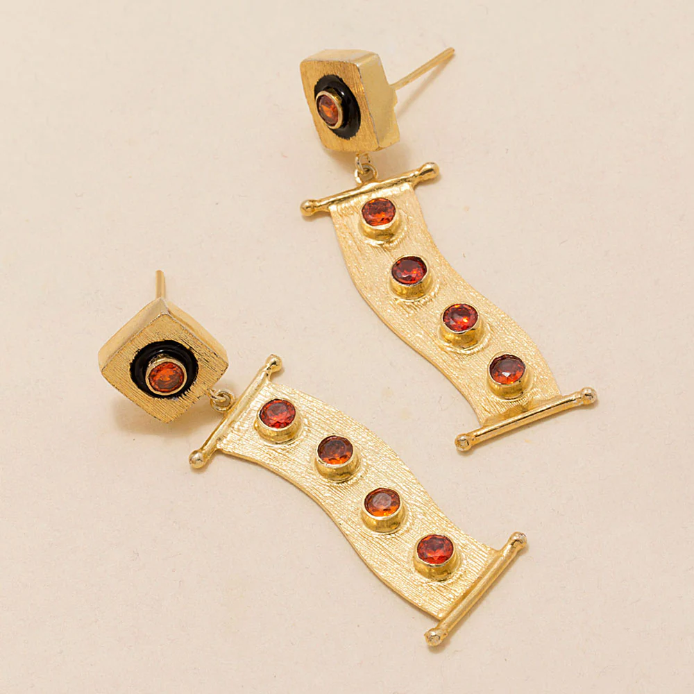 gleaming ruby adorned pair of danglers