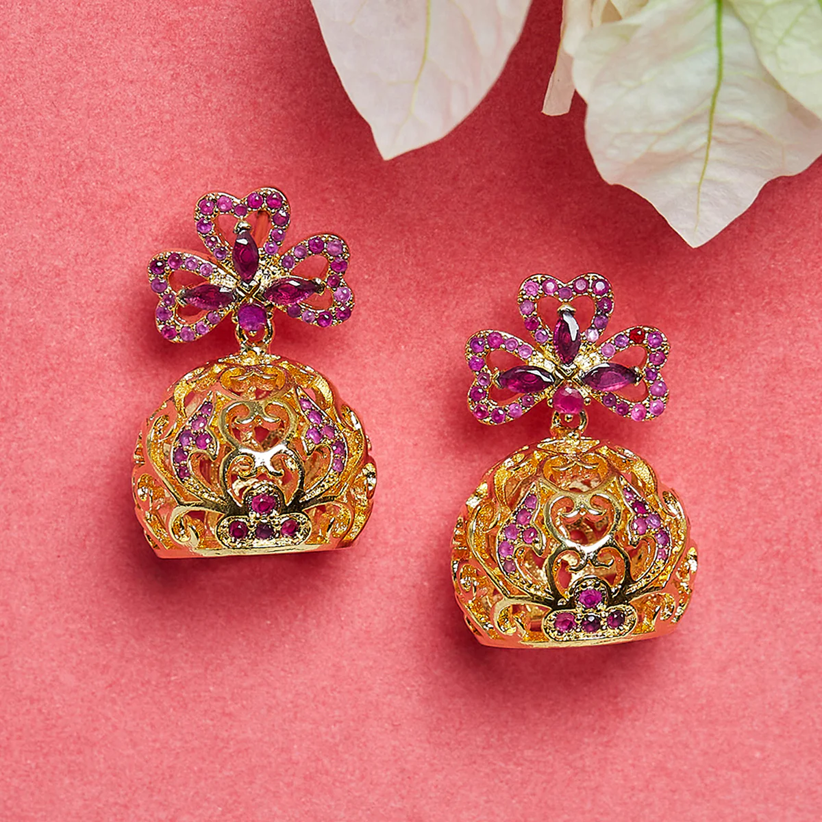 Gold Plated Chic Jhumki Earrings Ornamented With Pink Color Stones