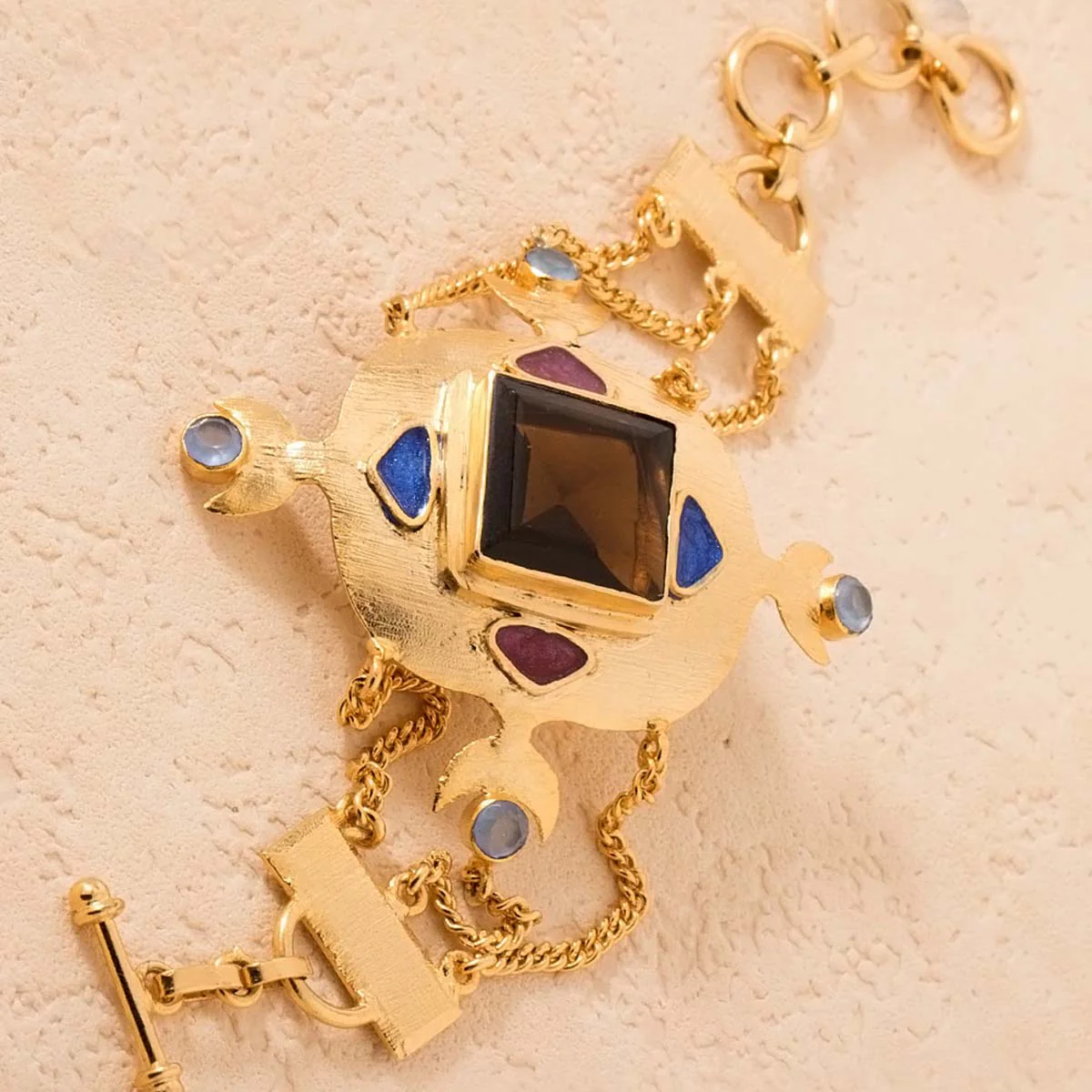 Gold Tone Bracelet Embellished With Smoky And Chalcy Stones