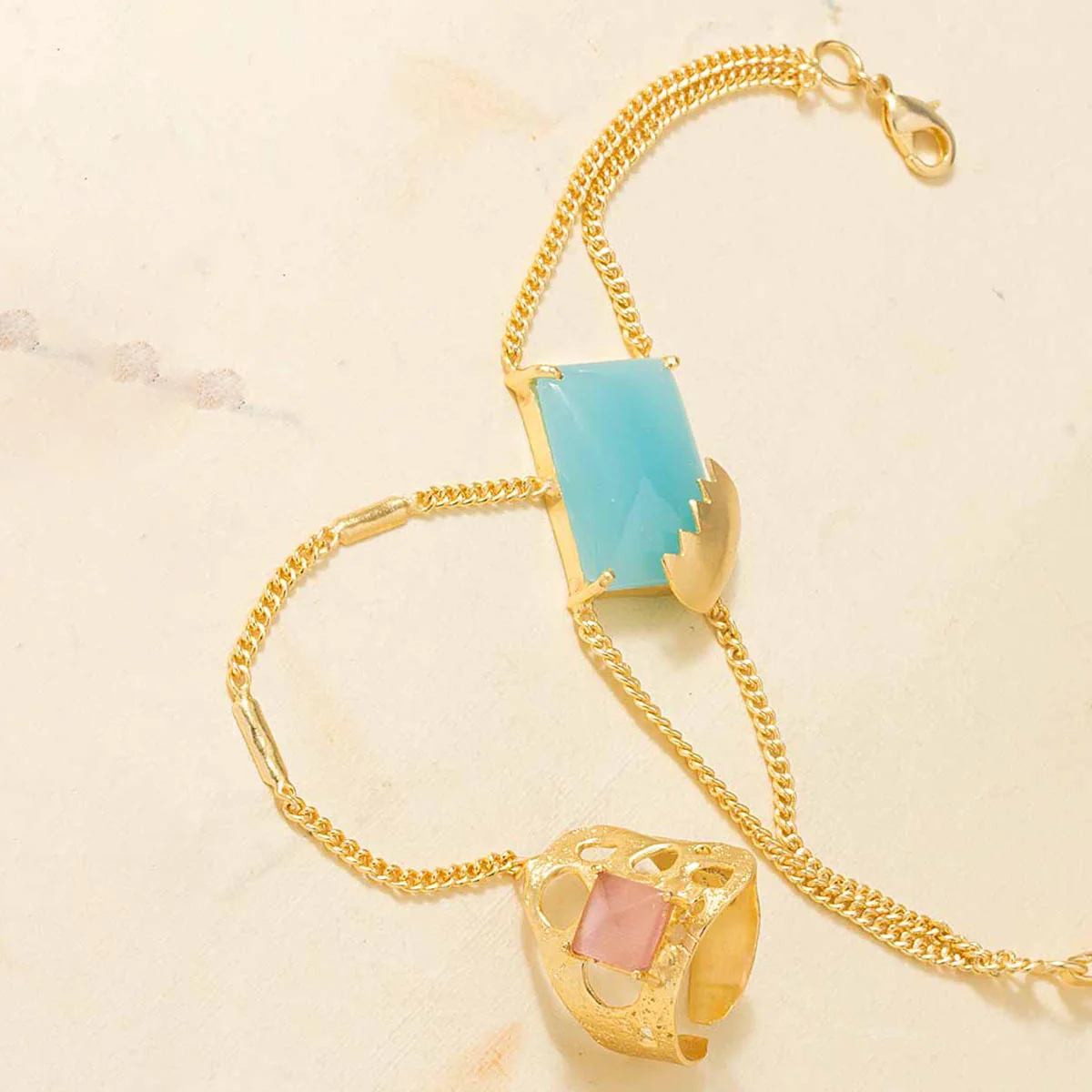 Gold Tone Slave Bracelet Decked With Pink-Blue Stone Embellishment