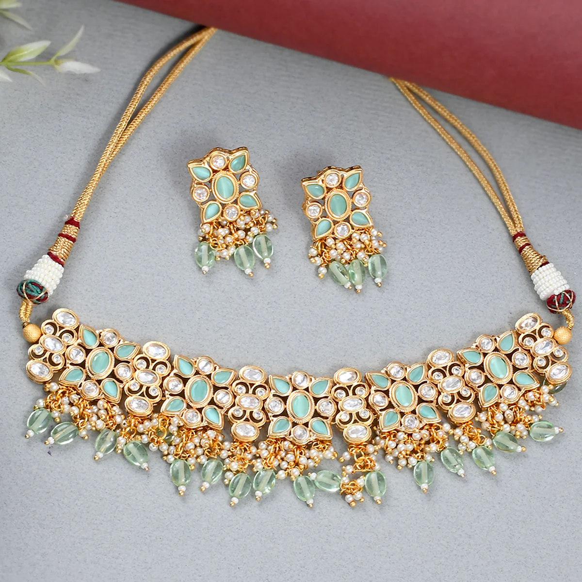 Oval Cut Faux Kundan Adorned Brass Gold Toned Jewellery Set