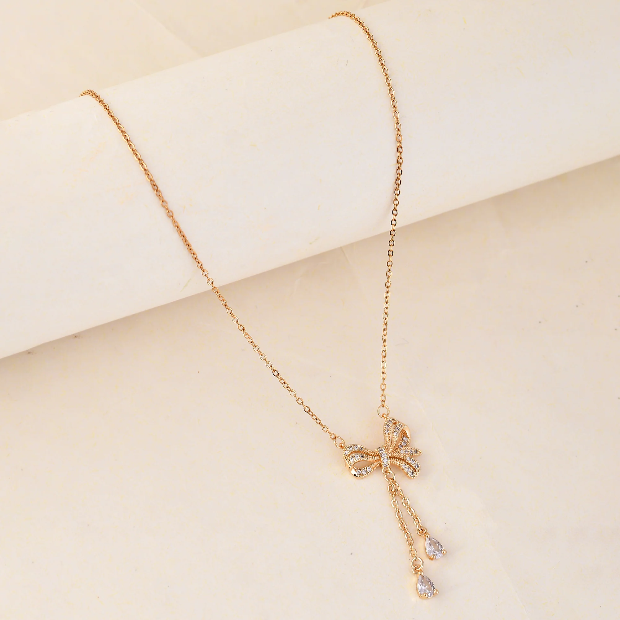 Scintillating Bow Charm Gold Plated Necklace