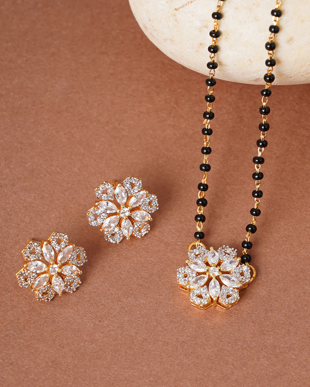 Shimmering Floret American Diamond CZ Gold Plated Brass Black Beaded Mangalsutra with Earrings