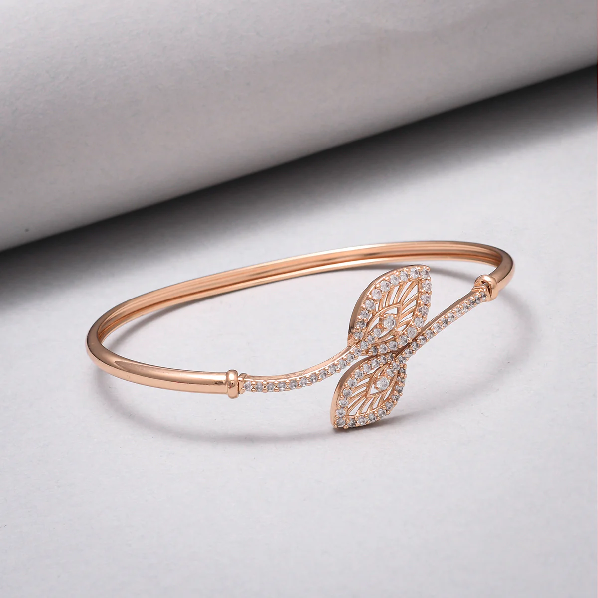 Sparkling Elegance Leaves Motifs CZ Adorned Brass Rose Gold Plated Bracelet