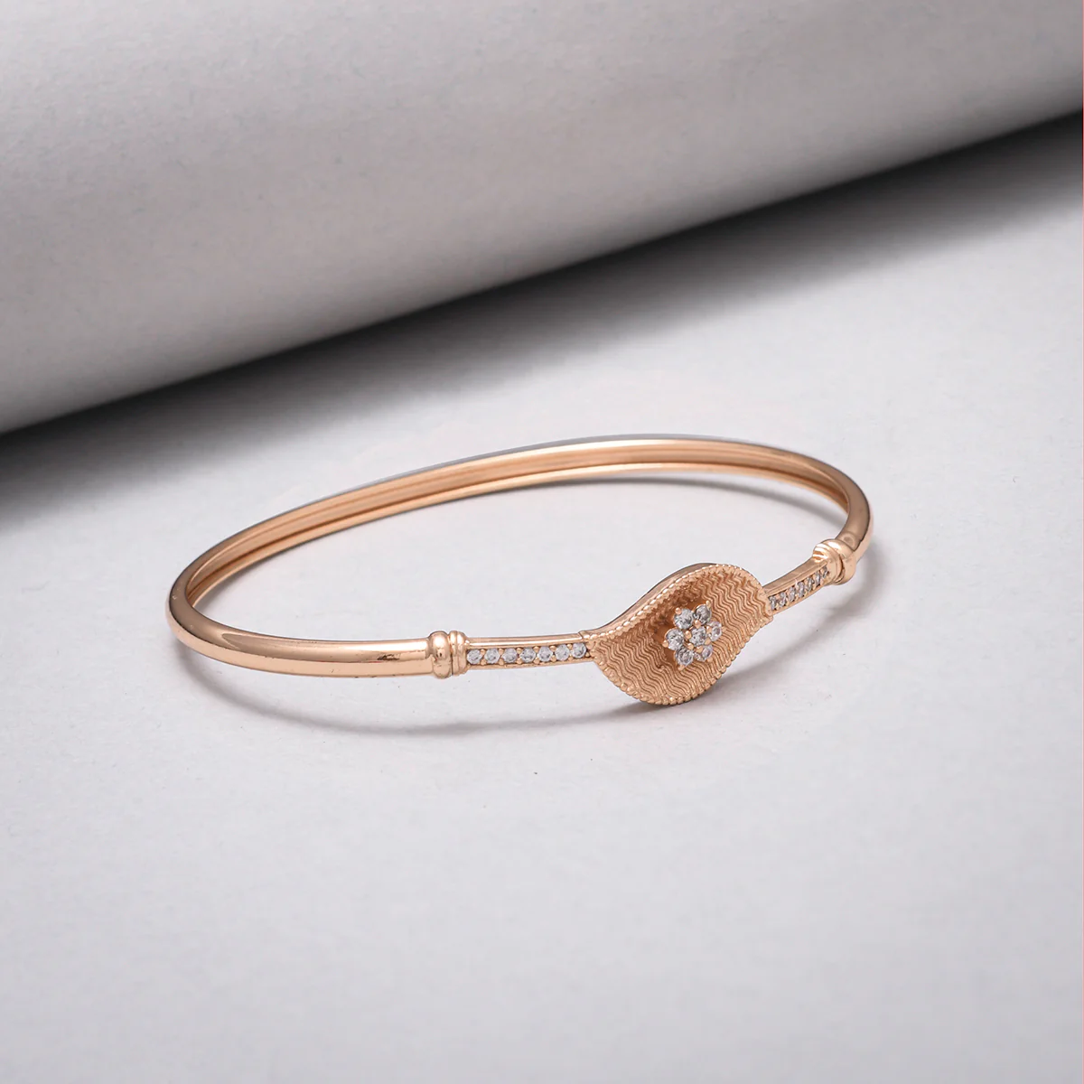 Sparkling Elegance Paisley Motif Zircons Adorned Brass Rose Gold Plated Bracelet