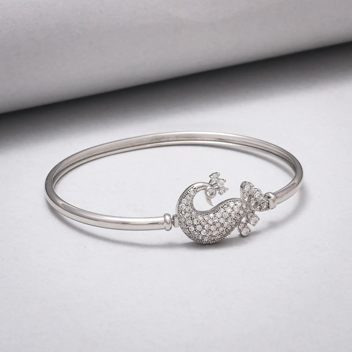 Sparkling Elegance Peacock Motif Zircons Adorned Brass Rhodium Plated Bracelet